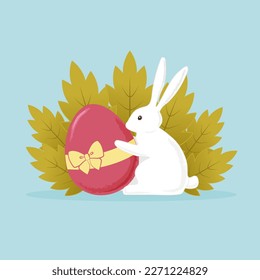 White cute bunny holding easter egg with the ribbon and bow. With big plants on the background.