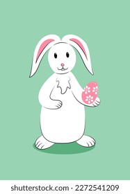 White cute easter rabbit with decorated egg