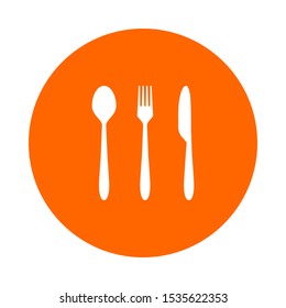 White cutlery and orange circle