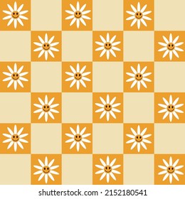  White daisy flower in smiley face on orange checkered squares seamless pattern . For textile, wallpaper and wrapping paper 