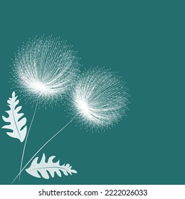 white dandelion on a green background