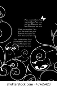 white decorative design on black with butterfly
