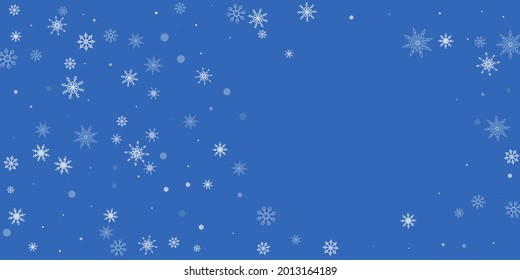 White delicate openwork snowflakes are scattered on a blue background. Festive background, postcard design, wallpaper