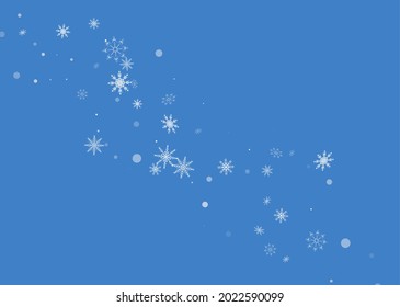 White delicate openwork snowflakes are scattered on a blue background. Festive background, postcard design, wallpaper