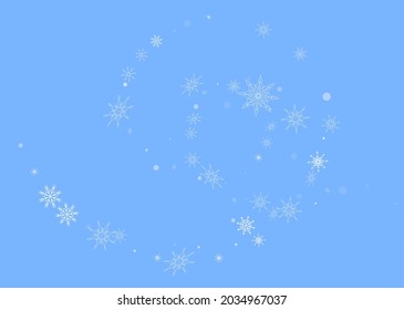 Los delicados copos de nieve a cielo abierto están esparcidos en un fondo azul. Fondo festivo, diseño postal, papel tapiz