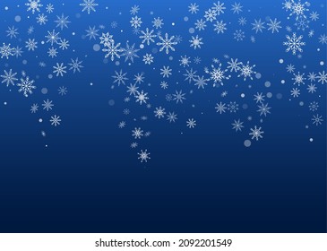 White delicate openwork snowflakes are scattered on a blue background. Festive background, postcard design, wallpaper