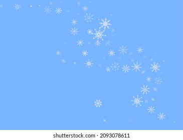 White delicate openwork snowflakes are scattered on a blue background. Festive background, postcard design, wallpaper