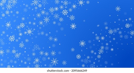 White delicate openwork snowflakes are scattered on a blue background. Festive background, postcard design, wallpaper