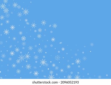 White delicate openwork snowflakes are scattered on a blue background. Festive background, postcard design, wallpaper
