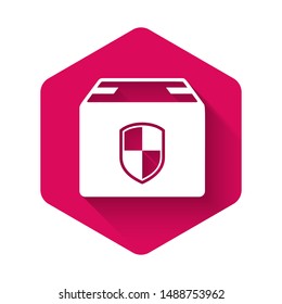 White Delivery pack security symbol with shield icon isolated with long shadow. Delivery insurance. Insured cardboard boxes beyond the shield. Pink hexagon button. Vector Illustration