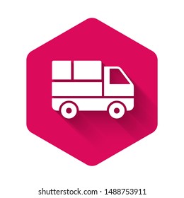 White Delivery truck with cardboard boxes behind icon isolated with long shadow. Pink hexagon button. Vector Illustration