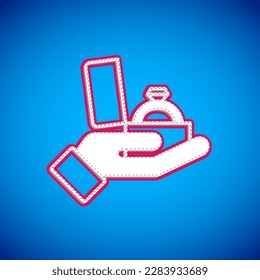 White Diamond engagement ring in a box icon isolated on blue background.  Vector