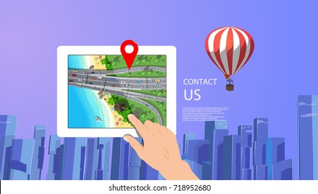 White digital tablet in hand with city map and big cityscape