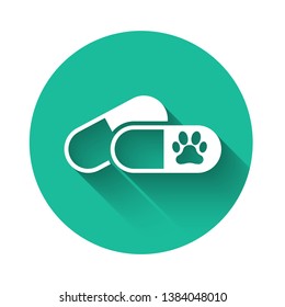 White Dog and pills icon isolated with long shadow. Prescription medicine for animal. Green circle button. Vector Illustration