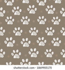 
White doodle paw print and little stars with brown background seamless pattern