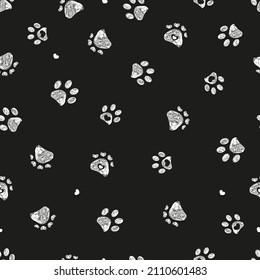 White doodle paw prints with hearts and black background seamless fabric design pattern and background