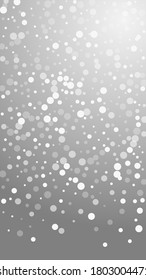 White dots Christmas background. Subtle flying snow flakes and stars on grey background. Amusing winter silver snowflake overlay template. Surprising vertical illustration.