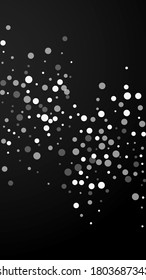 White dots Christmas background. Subtle flying snow flakes and stars on black background. Alive winter silver snowflake overlay template. Symmetrical vertical illustration.