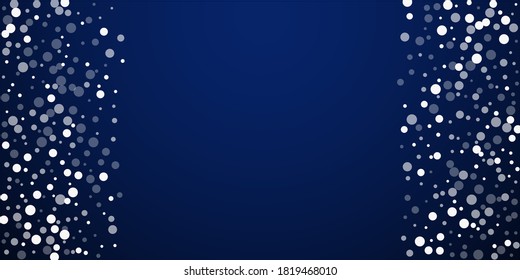 White dots Christmas background. Subtle flying snow flakes and stars on dark blue night background. Appealing winter silver snowflake overlay template. Fancy vector illustration.