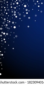 White dots Christmas background. Subtle flying snow flakes and stars on dark blue background. Alive winter silver snowflake overlay template. Original vertical illustration.