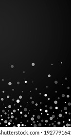 White dots Christmas background. Subtle flying snow flakes and stars on black background. Appealing winter silver snowflake overlay template. Posh vertical illustration.