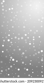 White dots Christmas background. Subtle flying snow flakes and stars on grey background. Alive winter silver snowflake overlay template. Divine vertical illustration.