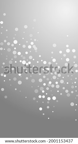 White dots Christmas background. Subtle flying snow flakes and stars on grey background. Alive winter silver snowflake overlay template. Terrific vertical illustration.