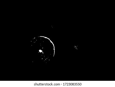 White dots of light are isolated on a black background