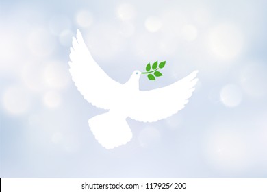 White dove carrying leaf branch and international day of peace. World Water Day. Vector image on blue blurred defocused background with bokeh ligth