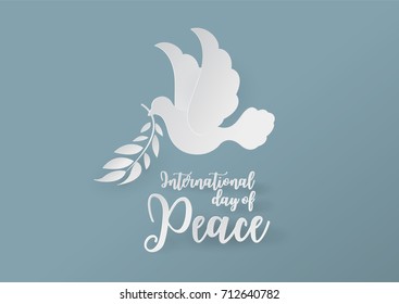 White Dove in Paper cutting Style on Blue Background for international day of peace