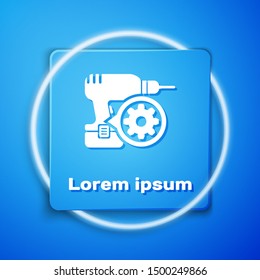 White Drill machine and gear icon isolated on blue background. Adjusting app, service concept, setting options, maintenance, repair, fixing. Blue square button. Vector Illustration