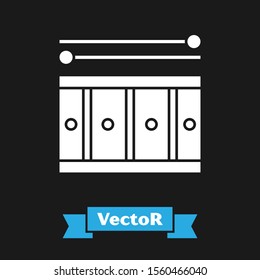 White Drum with drum sticks icon isolated on black background. Music sign. Musical instrument symbol.  Vector Illustration