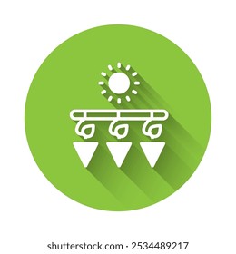 White Drying grapes icon isolated with long shadow background. Dried grapes. Green circle button. Vector