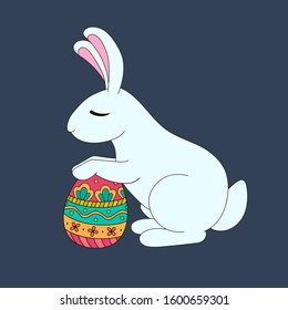 White easter bunny with a beautiful hand-painted egg