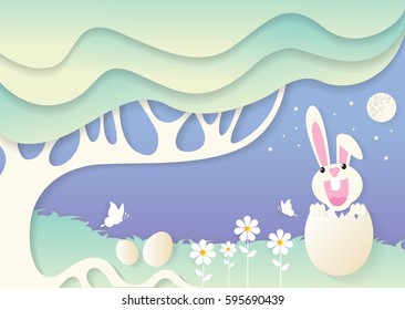 White Easter bunny with a eggs in a field