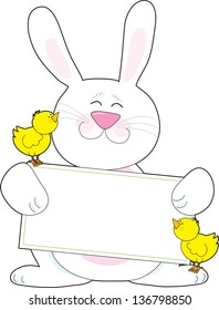 A white Easter bunny holds a blank message poster, while accompanied by two yellow baby chicks.