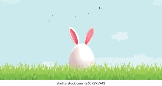 white easter egg bunny in green grass under a blue sky