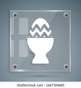White Easter egg on a stand icon isolated on grey background. Happy Easter. Square glass panels. Vector Illustration