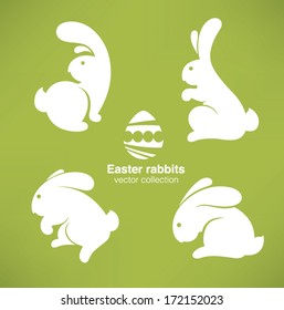 white Easter rabbits silhouettes on green background