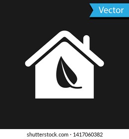 White Eco friendly house icon isolated on black background. Eco house with leaf. Vector Illustration