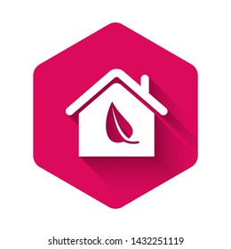 White Eco friendly house icon isolated with long shadow. Eco house with leaf. Pink hexagon button. Vector Illustration