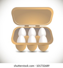 White eggs are in a box on a white background