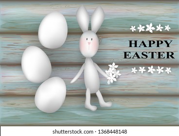 White eggs, bunny, flowers and text Happy Easter on wooden texture. Greeting card happy easter. 