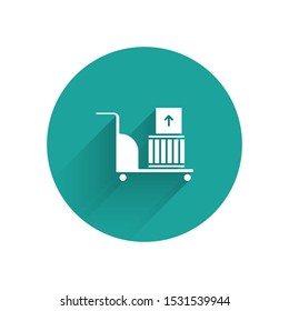 White Electric hand truck and boxes icon isolated with long shadow. Dolly symbol. Green circle button. Vector Illustration