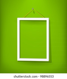 White empty frame with glass hang on the green wall. Eps10. Used opacity layers for effects shadow