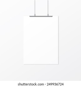 White empty paper with clips on the wall