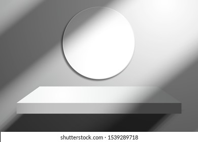 White empty shelf and round frame on the wall. Template with realistic oblique shadows from the window
