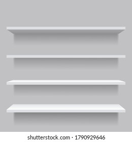 White empty shelves on gray wall.
