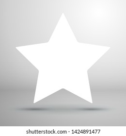 White empty star with shadow on white wall background. Mockup for design