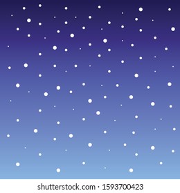 white falling snow against a beautifully colored gradient blue sky in the winter season before Christmas